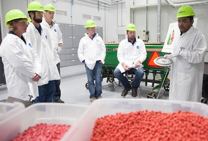 During a training session at the Seedcare Institute, Wanderson Oliveira (far right), Syngenta Seedcare platform specialist, explains best practices of handling treated seeds at planting to a group of customers.