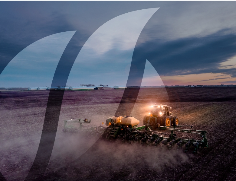 tractor planting golden harvest seed at night