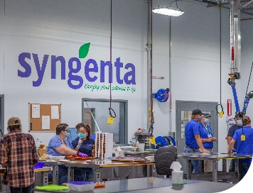people working inside Slater, Iowa research & development laboratory